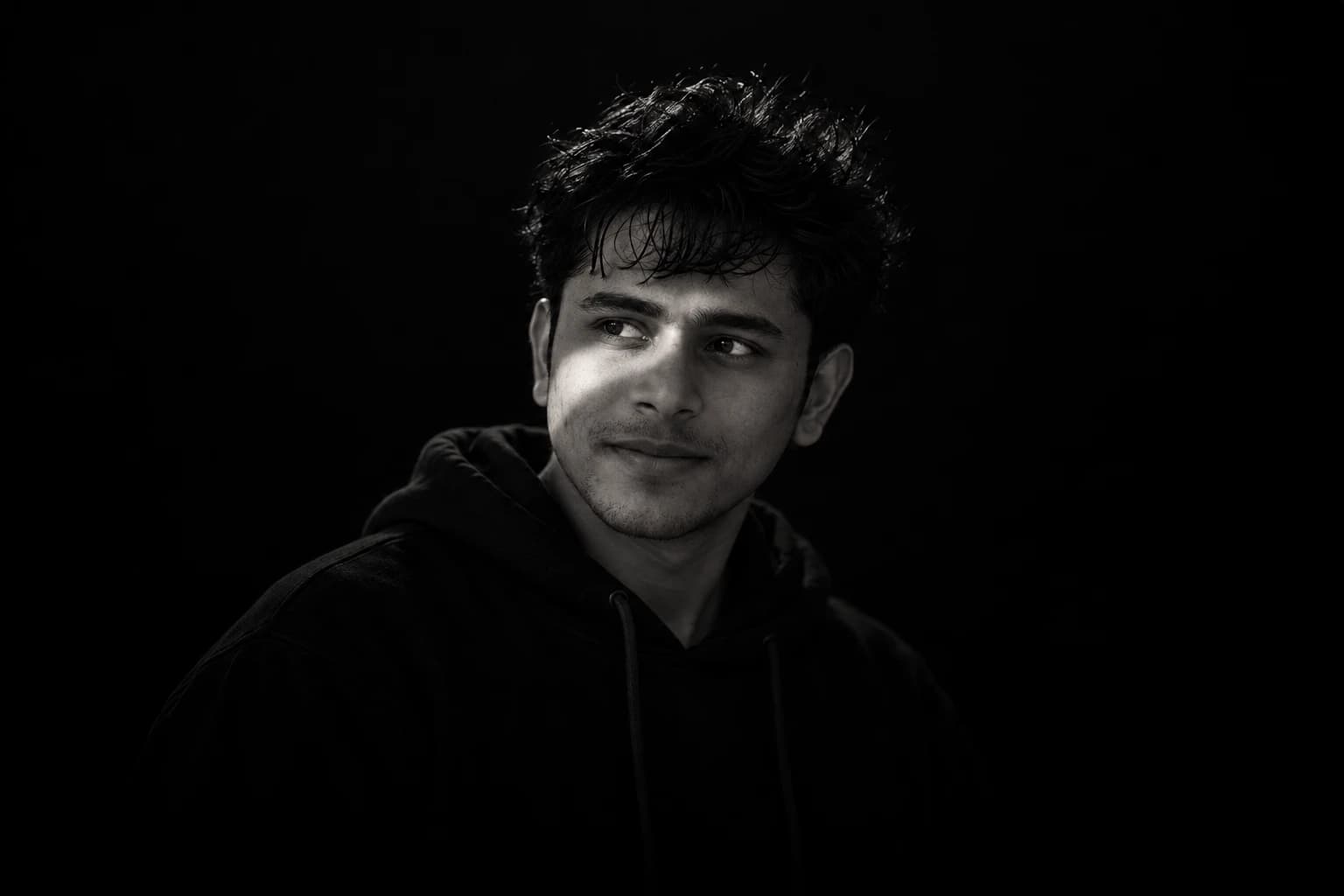 Ganesh Datta G, black-and-white front-angle portrait looking left